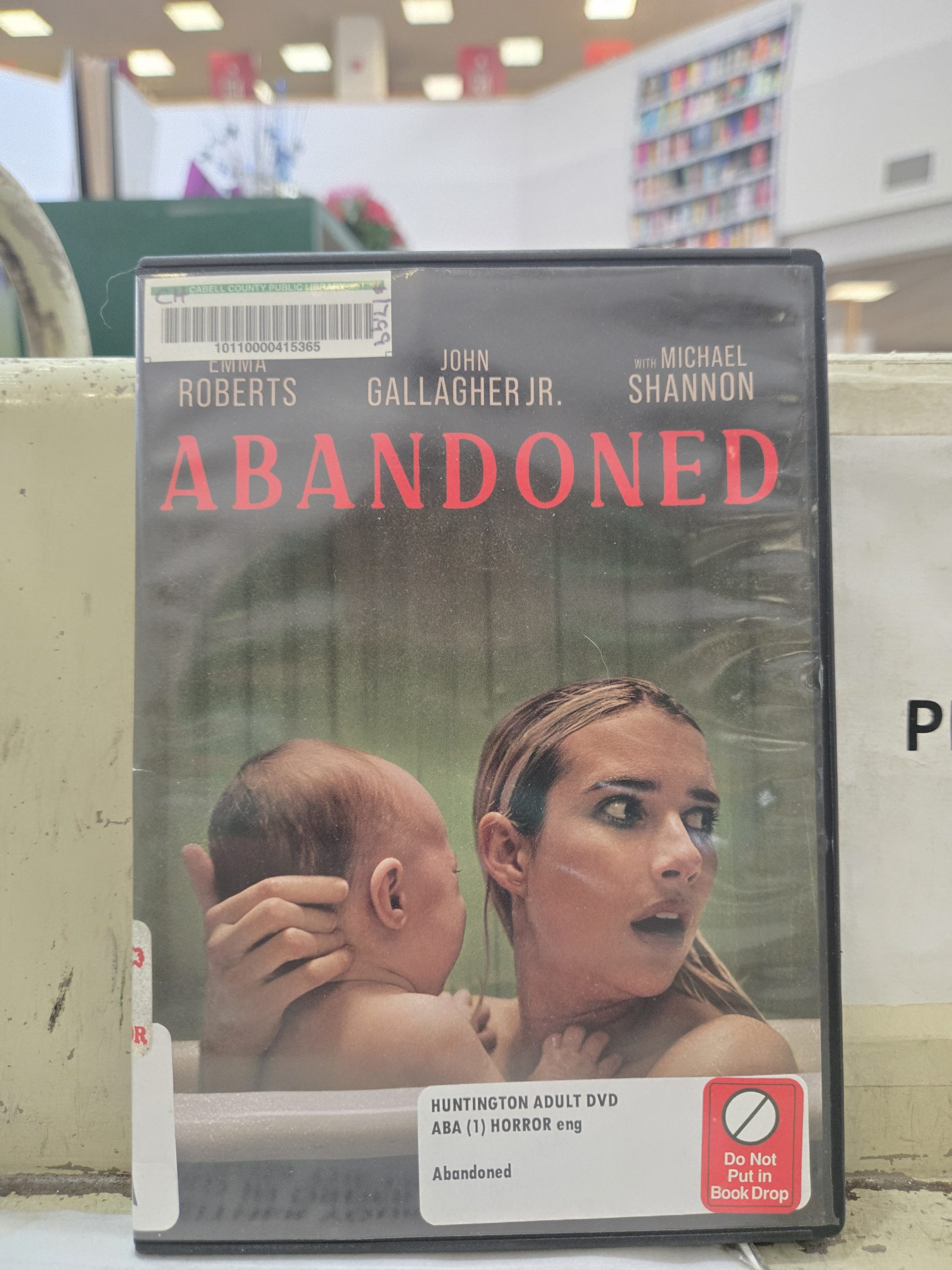 Abandoned DVD case sitting on cabell county public library checkout stand