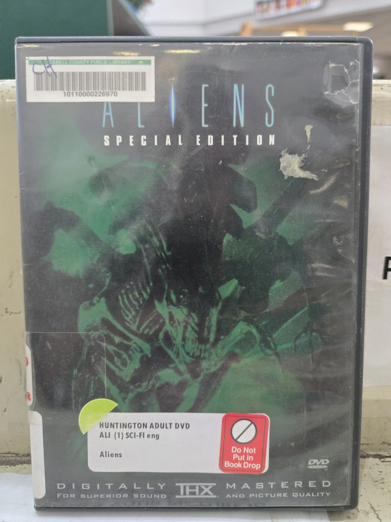 Aliens special edition dvd case from cabell county public library sitting on checkout cart